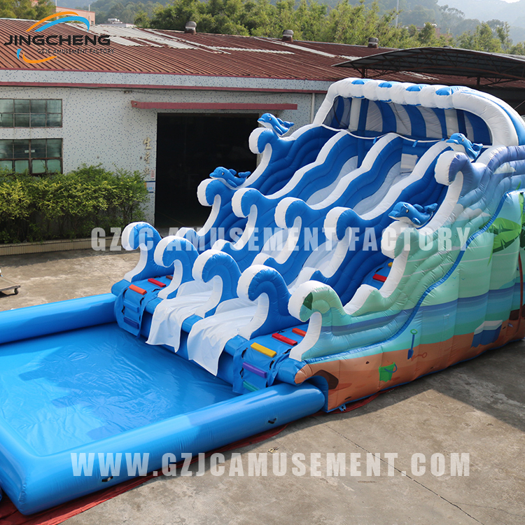 Two-lane blue fantasy water slide with inflatable pool